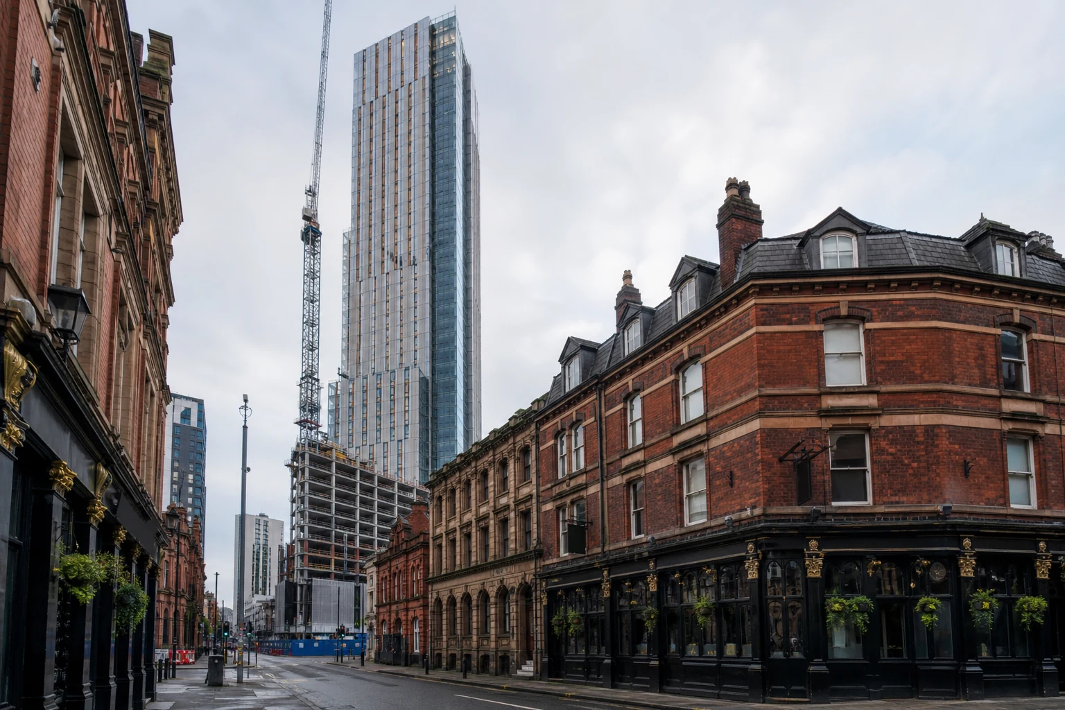 New Manchester skyscraper rising behind preserved historic city-centre buildings