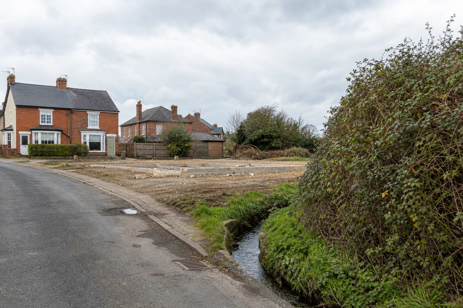 Proposed housing site beside established homes, hedgerows and constrained local infrastructure